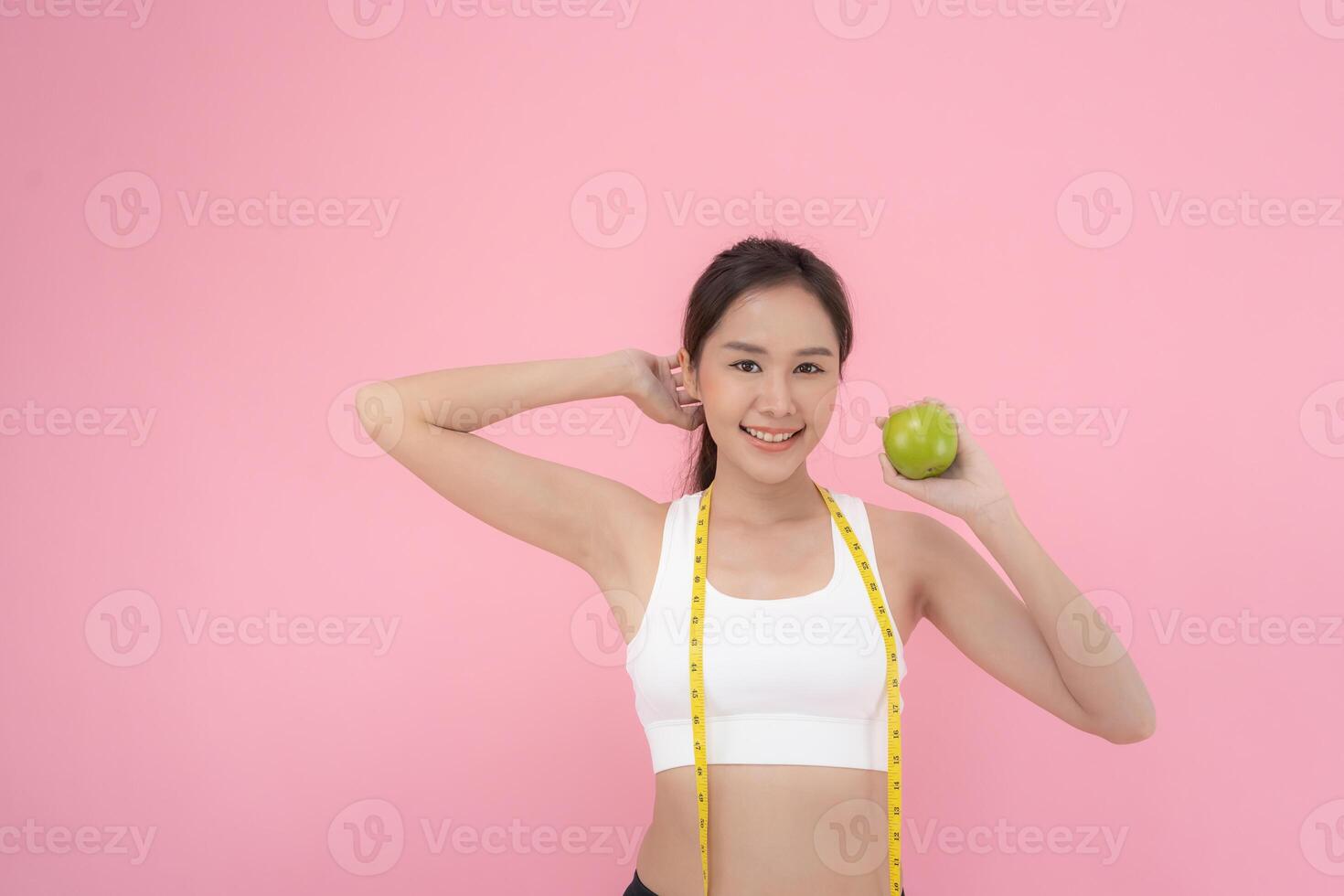 slim body asian women choose healthy foods, dieting female choose green apple for diet. Good healthy food. weight lose, balance, control, reduce fat, low calories, routines, exercise, body shape. photo