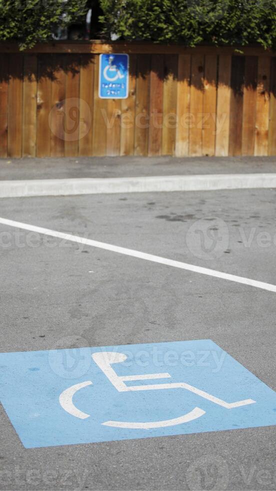A handicap sign on the ground photo