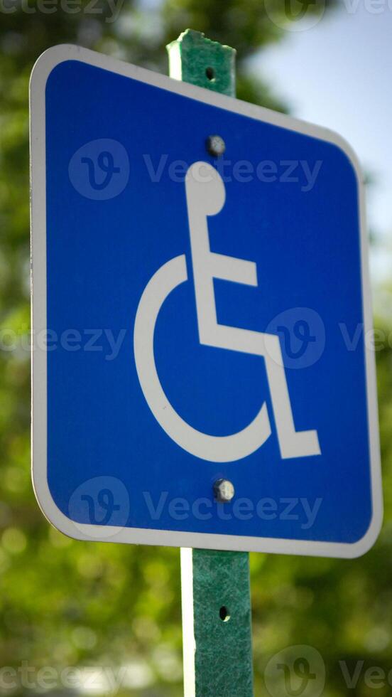 A blue sign with a white symbol on it photo