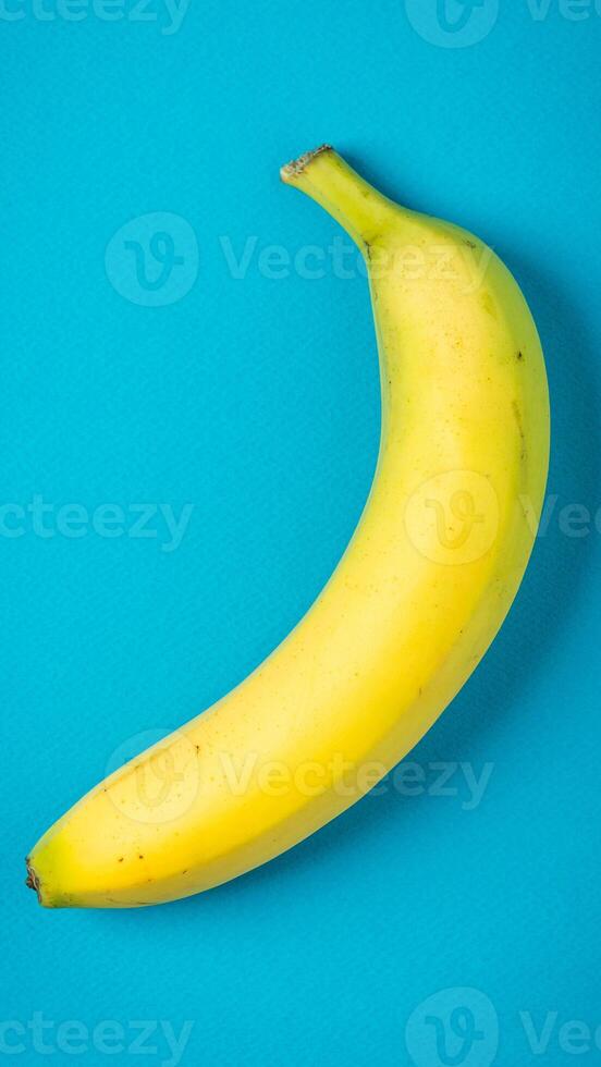 A banana on a blue background photo