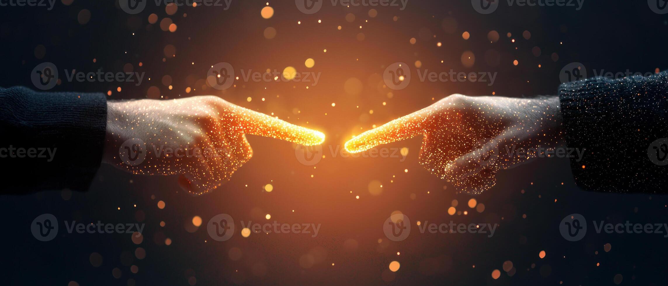 Two hands reaching toward each other, symbolizing connection and unity in a dark setting. photo