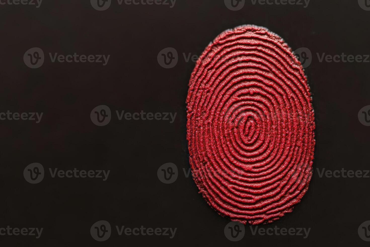 An artistic representation of a red fingerprint on a black background. photo