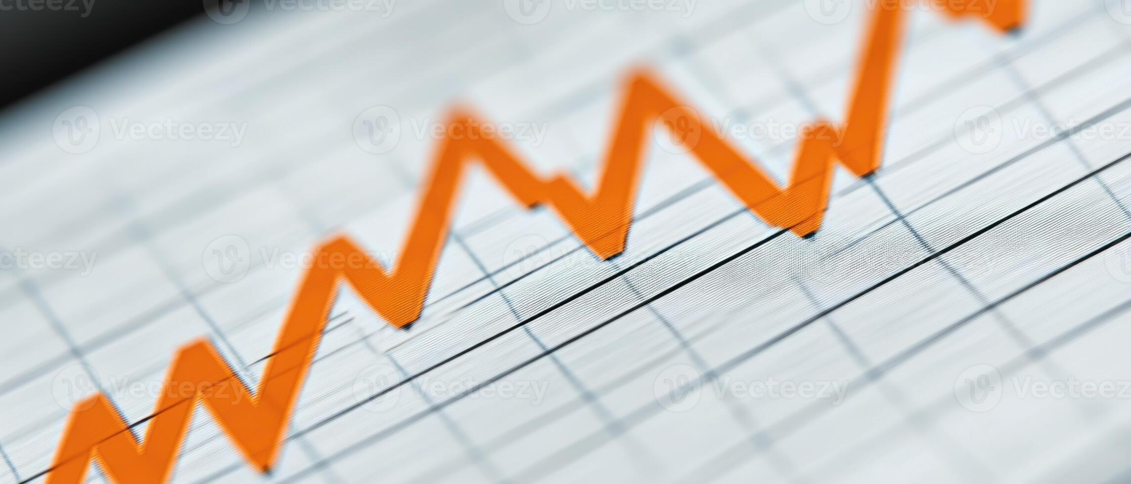 Close-up of a graph with rising orange line illustrating financial growth and success. photo