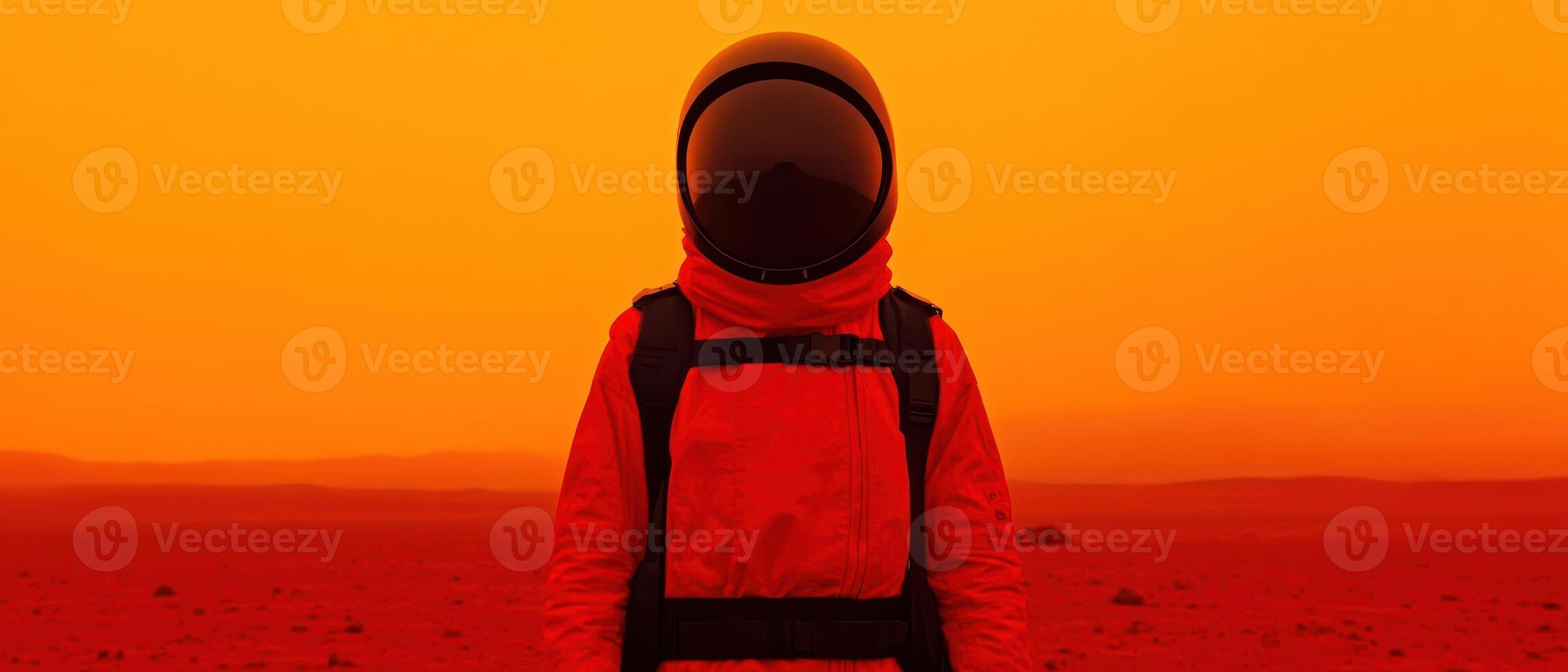 Astronaut exploring a vibrant alien landscape under a red sky on another planet. photo