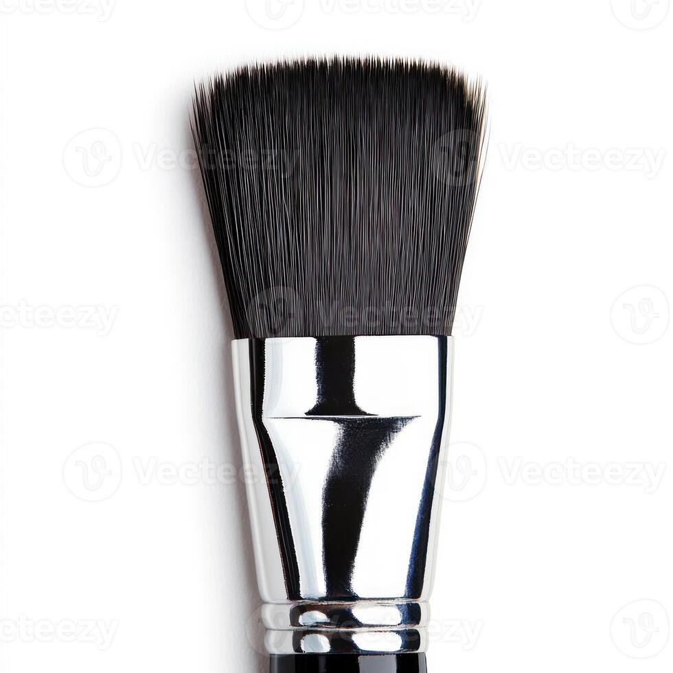 A close-up of a professional makeup brush with soft bristles. isolated on white background. photo