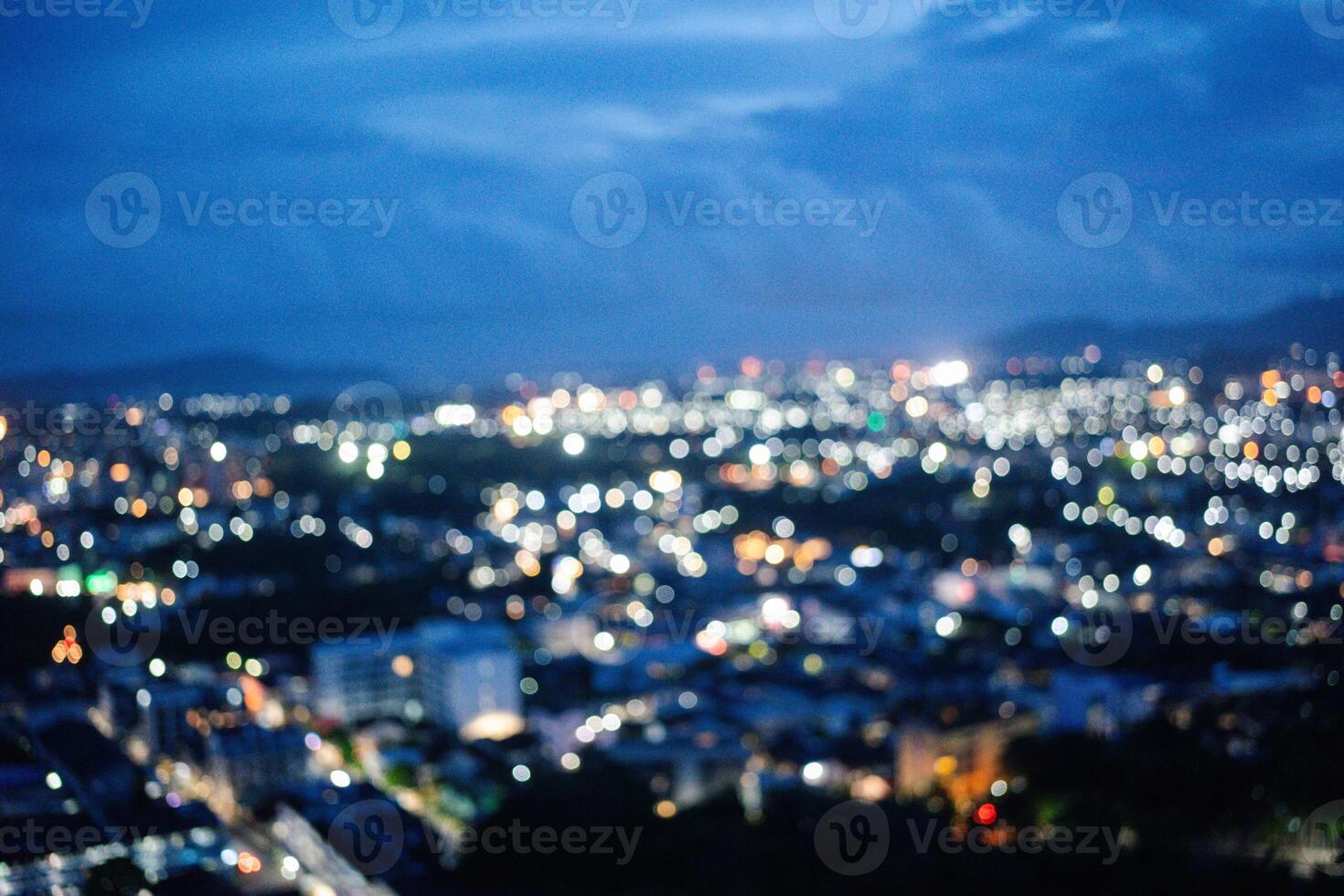 An abstract blurry image of a city skyline at sunset. photo