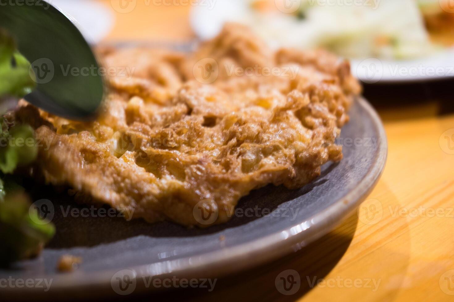 Thai crispy omelette stuffed minced pork. photo