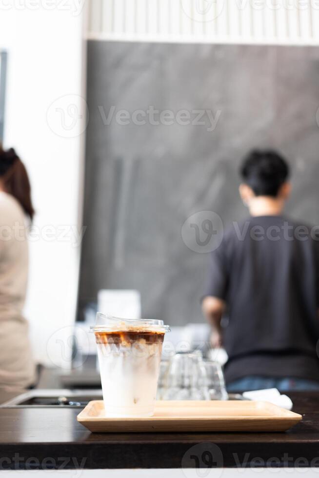 A glass of iced latte coffee photo
