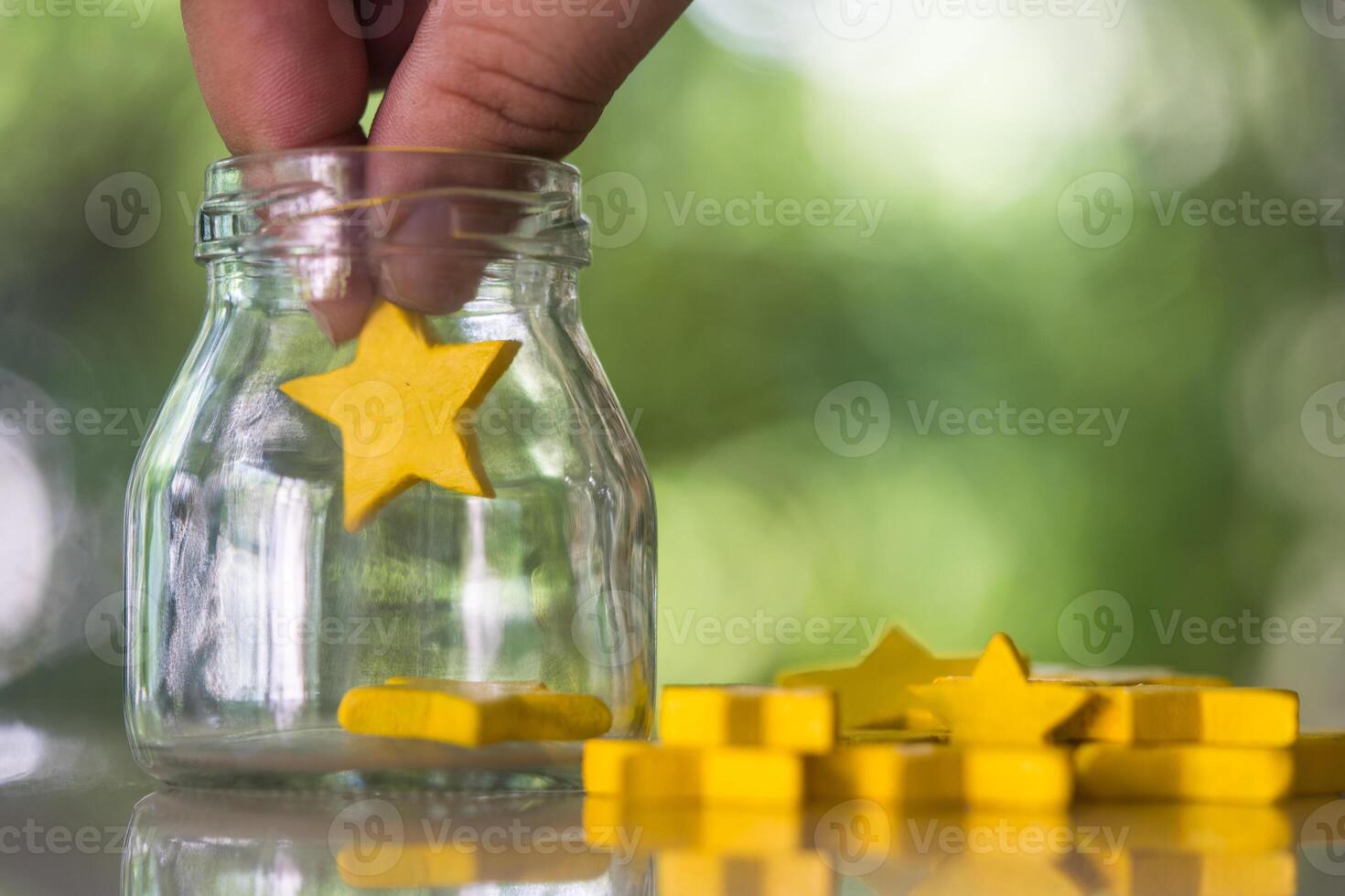 Hand man put star in glass box. Customer service experience and business satisfaction feedback survey photo