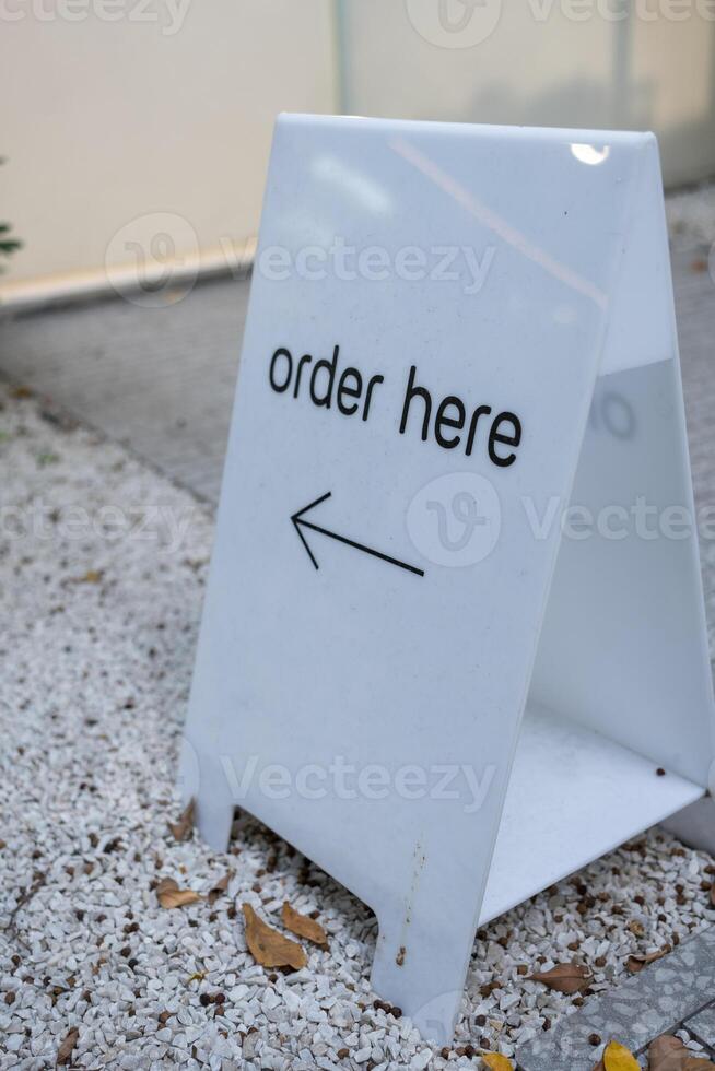 Order here sign at cafe restaurant photo