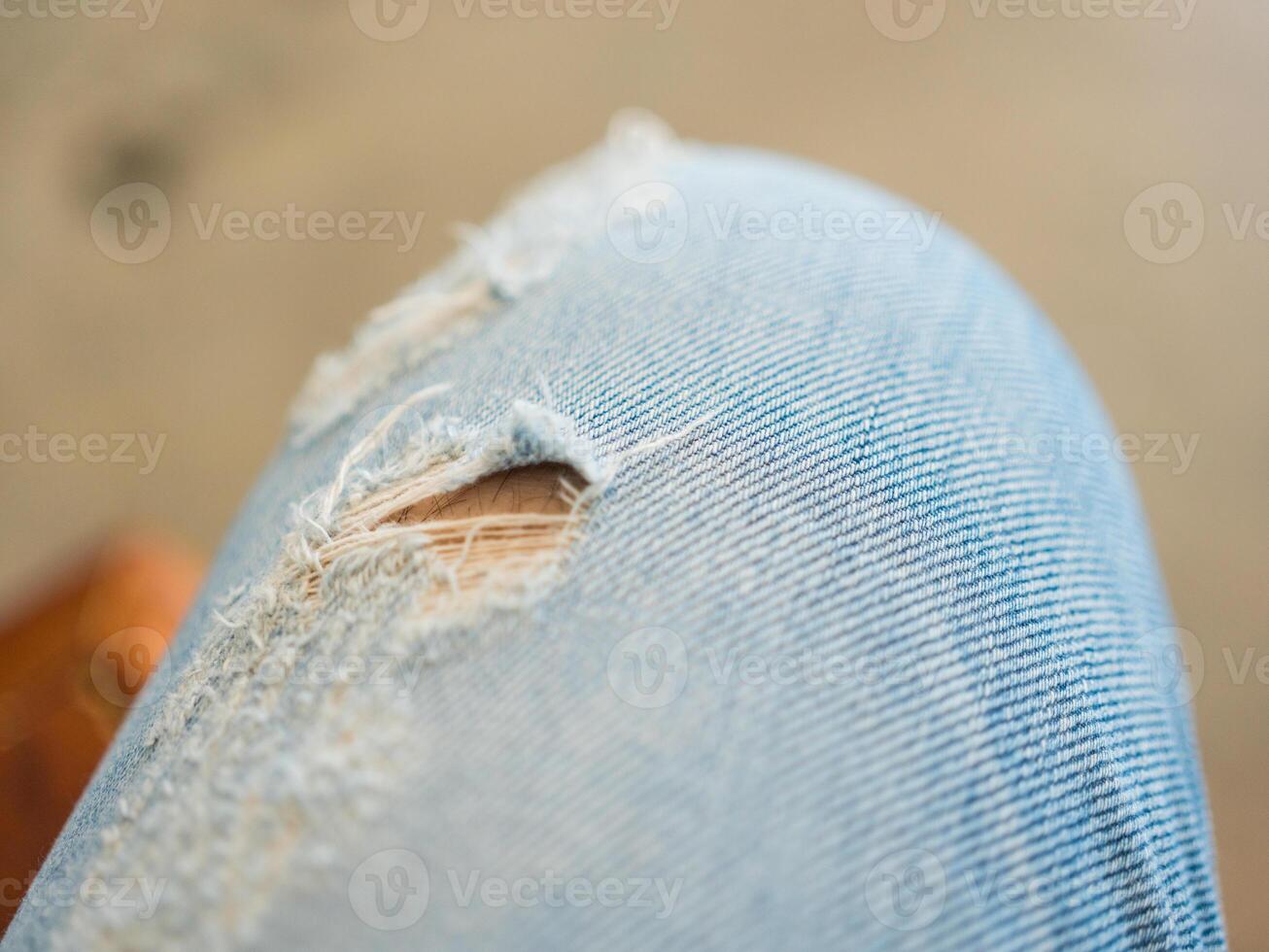 Teenager in ripped jeans. photo