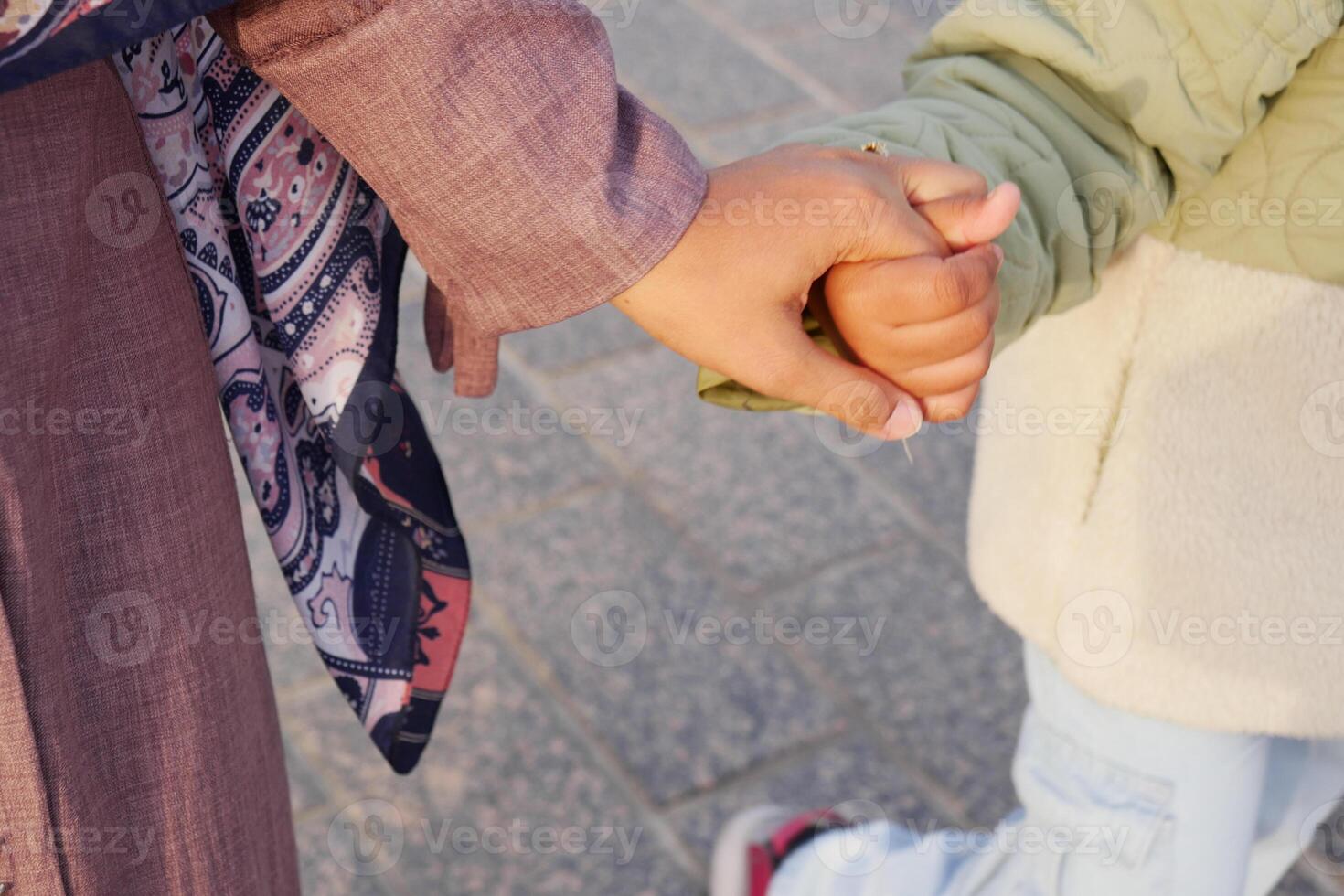 Tender Moment A Child Holding an Adults Hand, a beautiful symbol of love and connection photo
