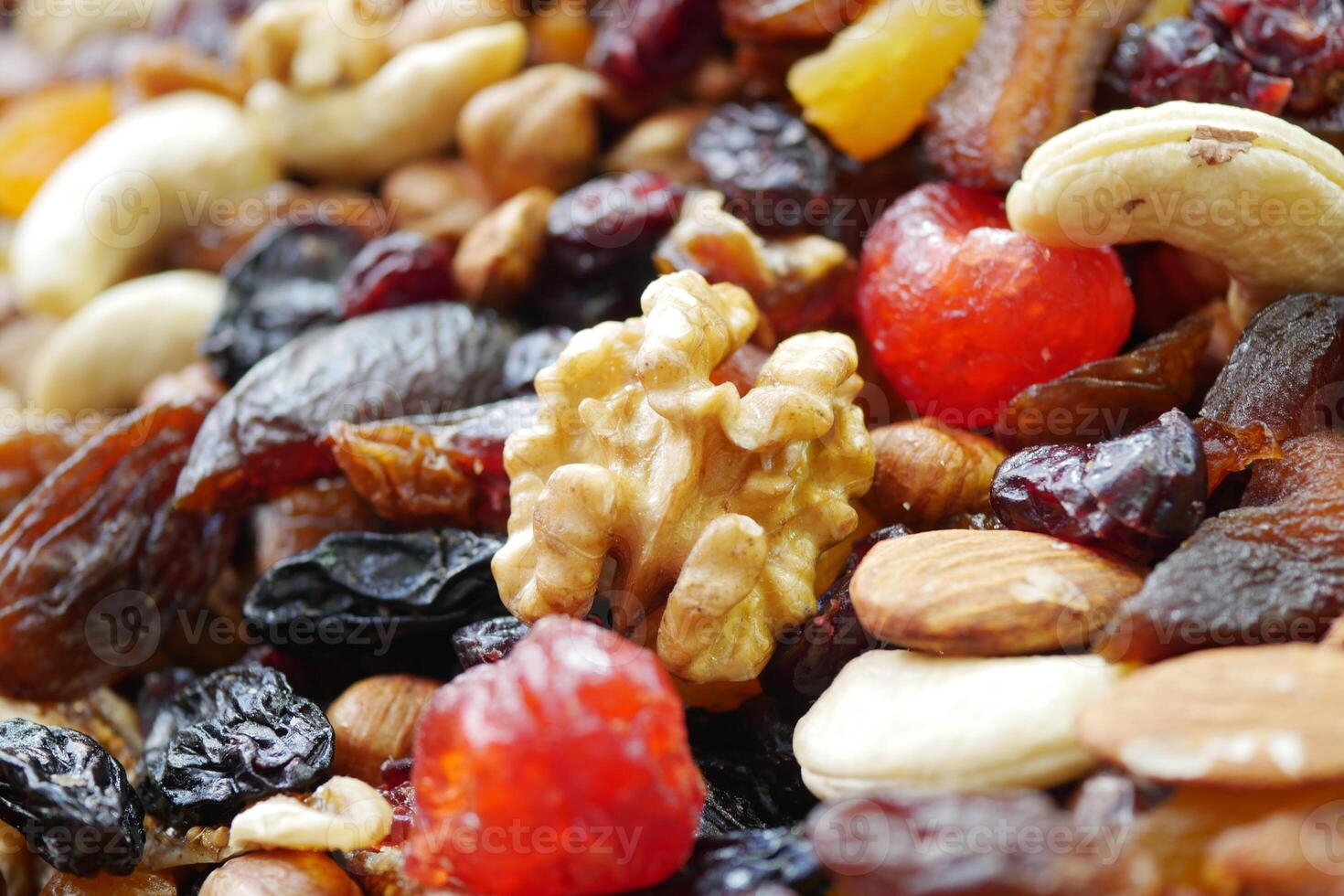 Closeup of mixed nuts and dried fruits highlighting their beauty and texture photo