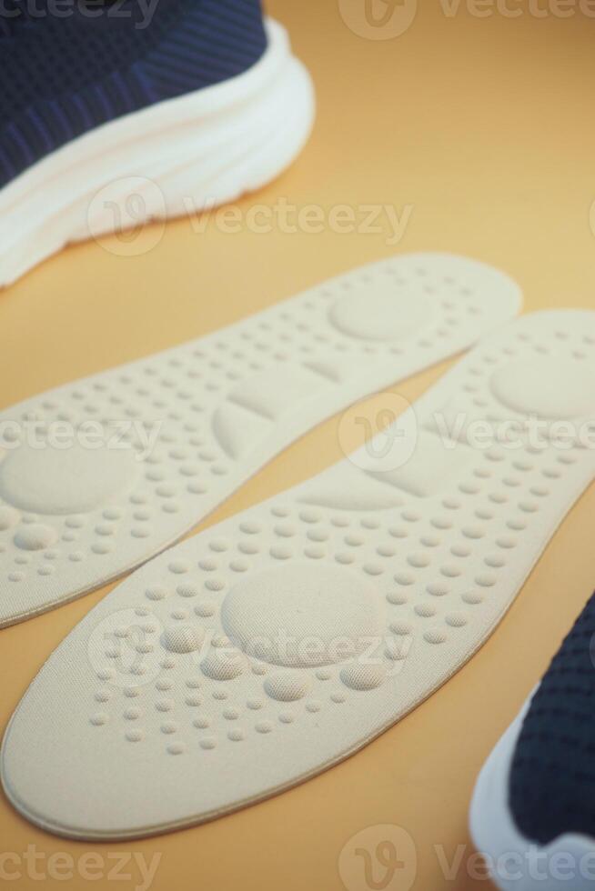 A CloseUp Image of Soft Shoe Insoles Displayed on a Colorful Background photo