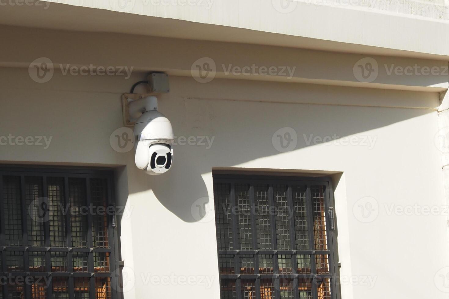 Security Camera Successfully Mounted on the Wall for Optimal Surveillance Purpose and Use photo
