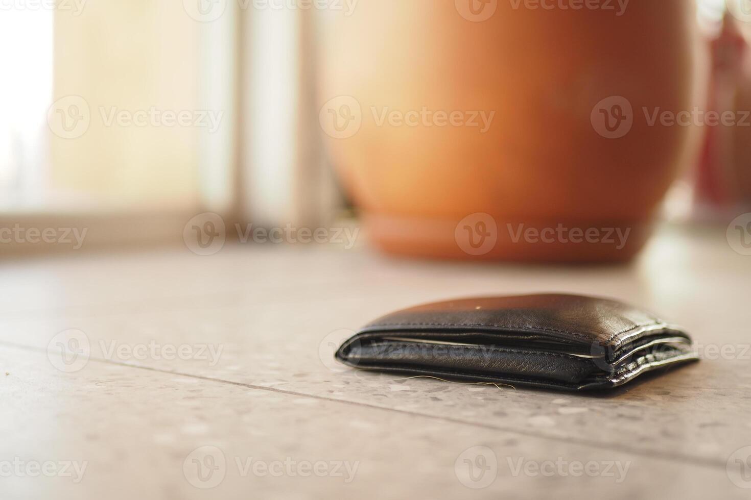 left wallet on floor at home photo