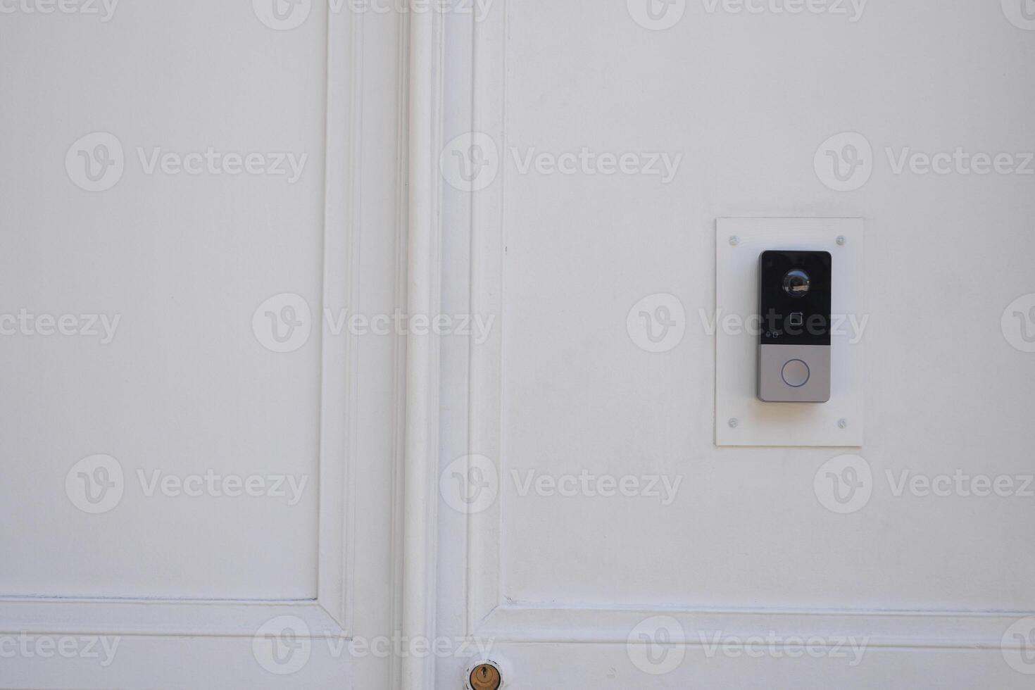 Contemporary Modern Doorbell Installed on a White Wall for Enhanced Home Security Solutions photo