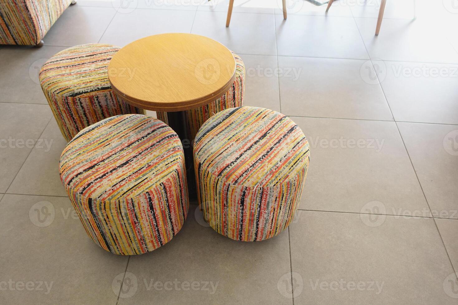 Colorful Round Stools and Table in Modern Interior Setting photo