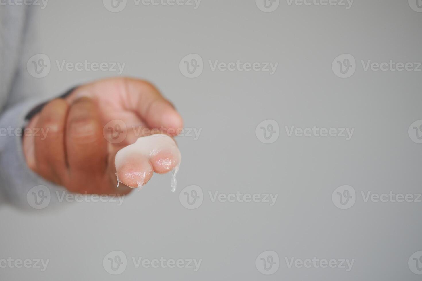 Close up of man hand using petroleum jelly photo