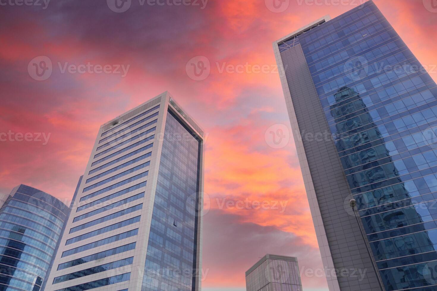 Captivating and stunning view of an Urban Skyline beautifully enhanced by Dramatic Sunset Clouds photo