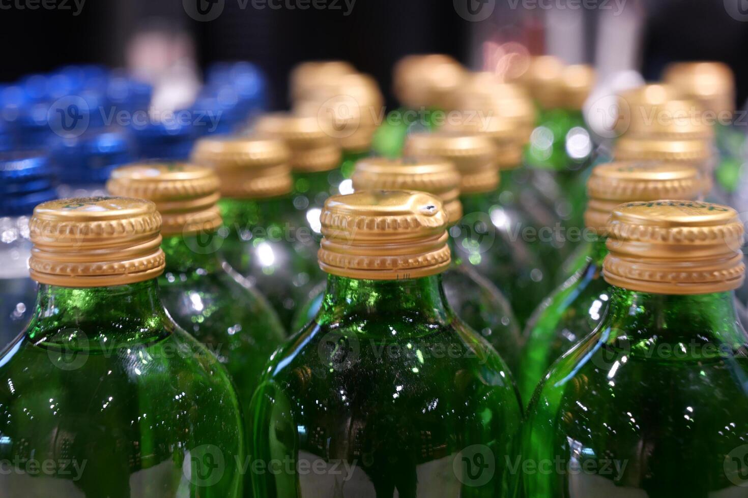Close-up of Bottled Juices in Refrigerator Display, Brightly Lit in Grocery Store photo