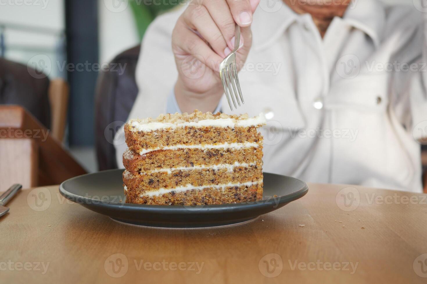 An Indulgent Slice of Deliciously Moist Carrot Cake Served in a Chic Modern Cafe Setting photo