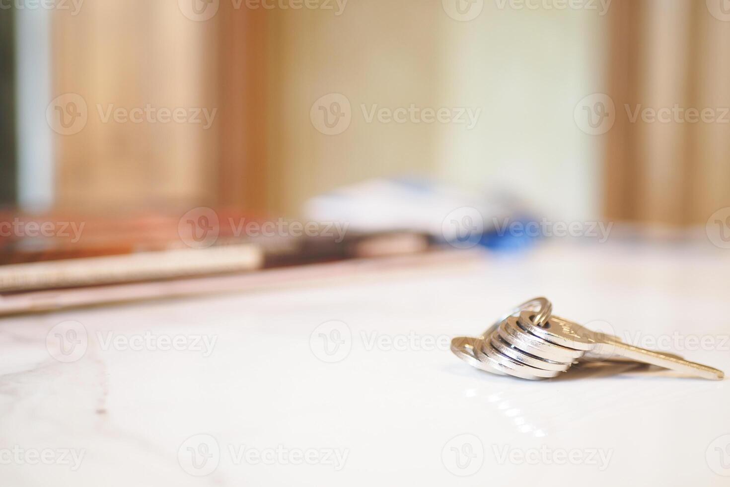 house keys on the ring on table in a room. To forget keys at home concept , photo