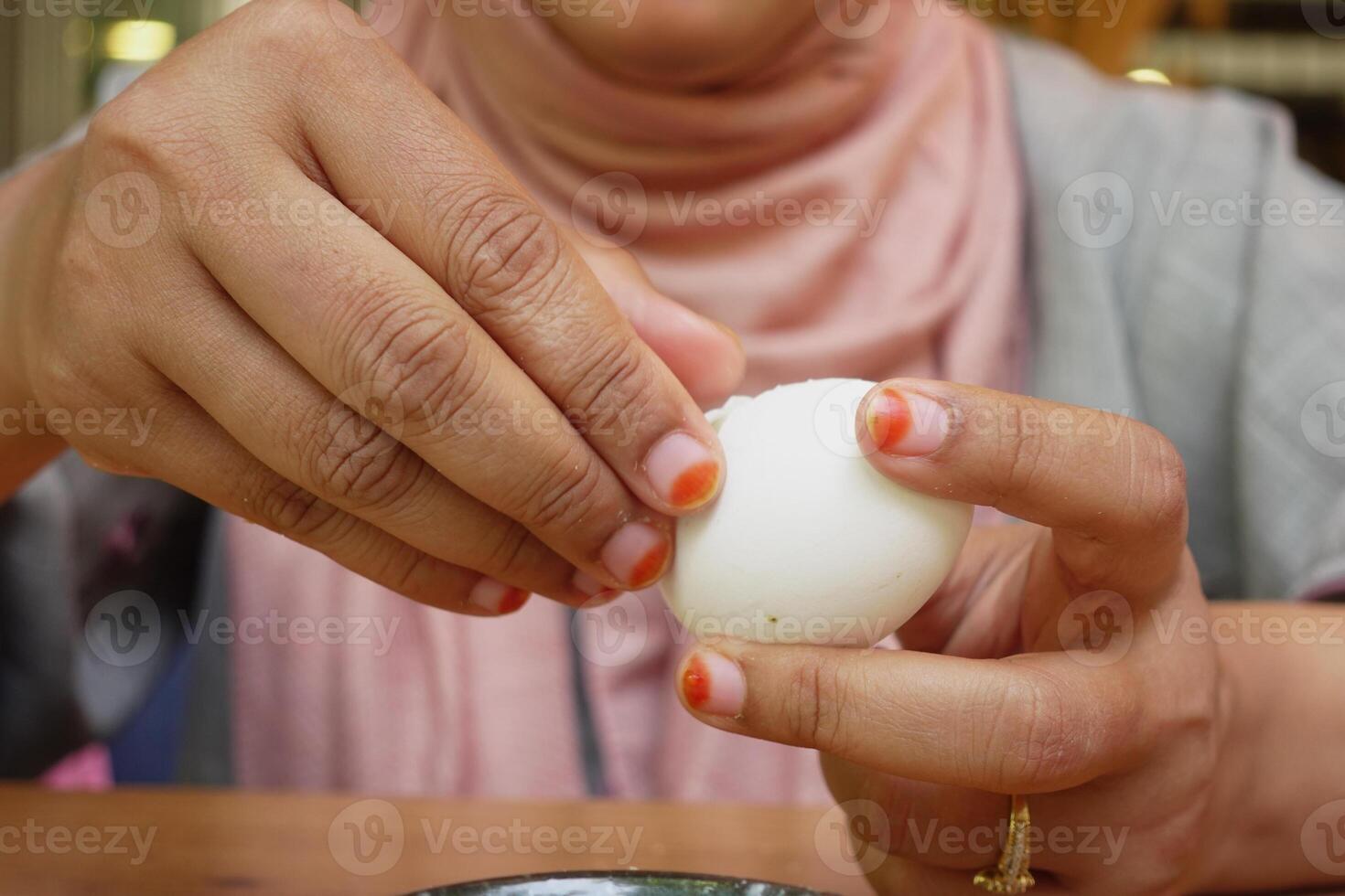 women hand perfectly Peeled Boiled Eggs photo