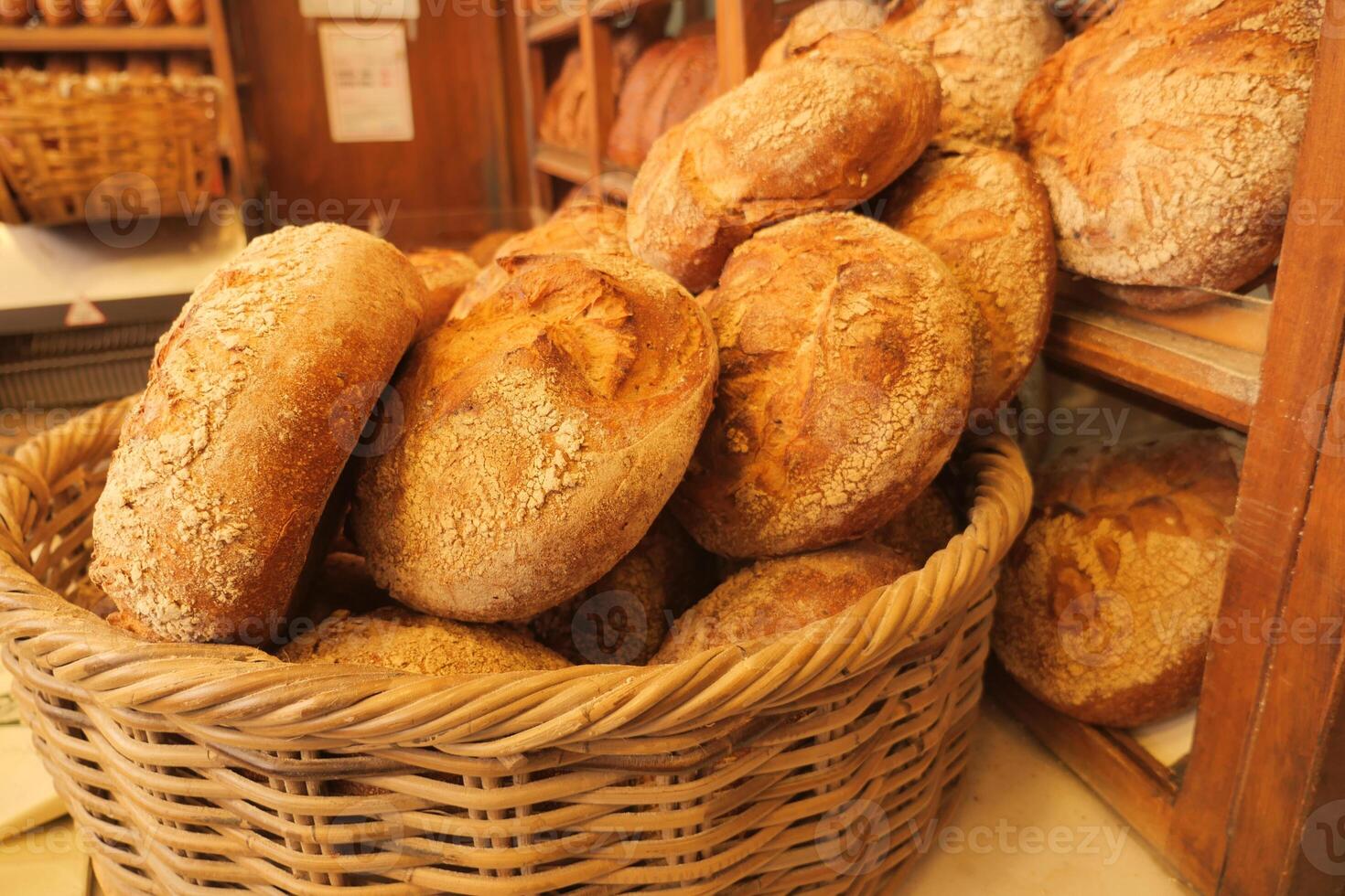 A Warm and Freshly Baked Artisan Bread Presented in a Charming Rustic Bakery Basket photo