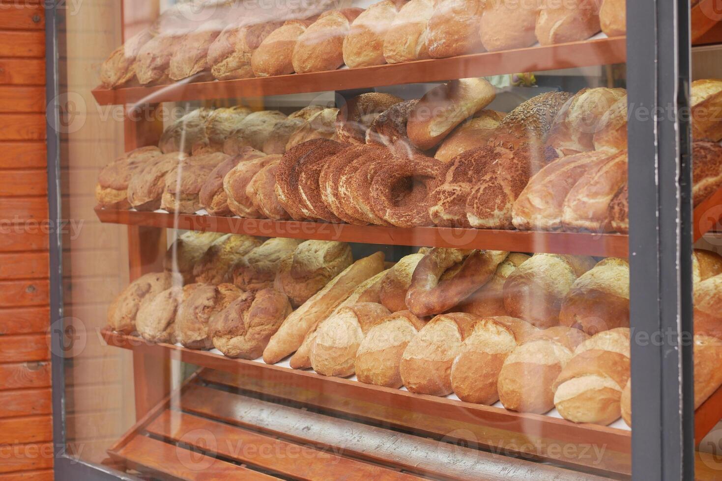 A Beautiful Array of Freshly Baked Breads Displayed Temptingly in a Bakery Window photo