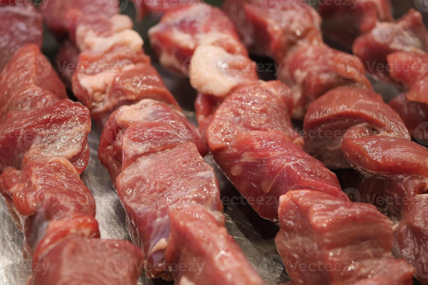 Deliciously Freshly Cut Raw Meat Skewers Perfectly Prepared and Ready for Grilling Anytime photo