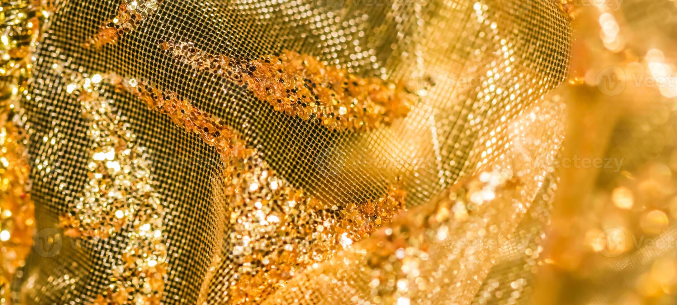 Golden abstract blur defocused background. Concept for New Years Eve, Christmas and happy holidays photo