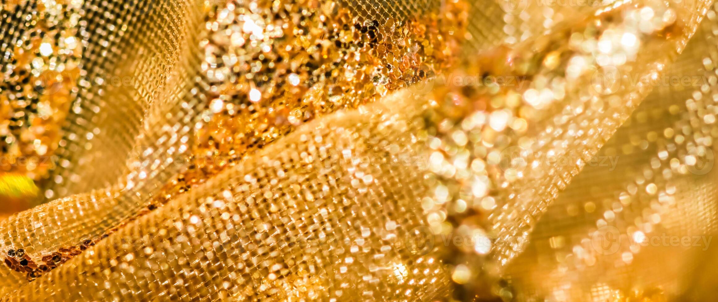 Golden abstract blur defocused background. Concept for New Years Eve, Christmas and happy holidays photo