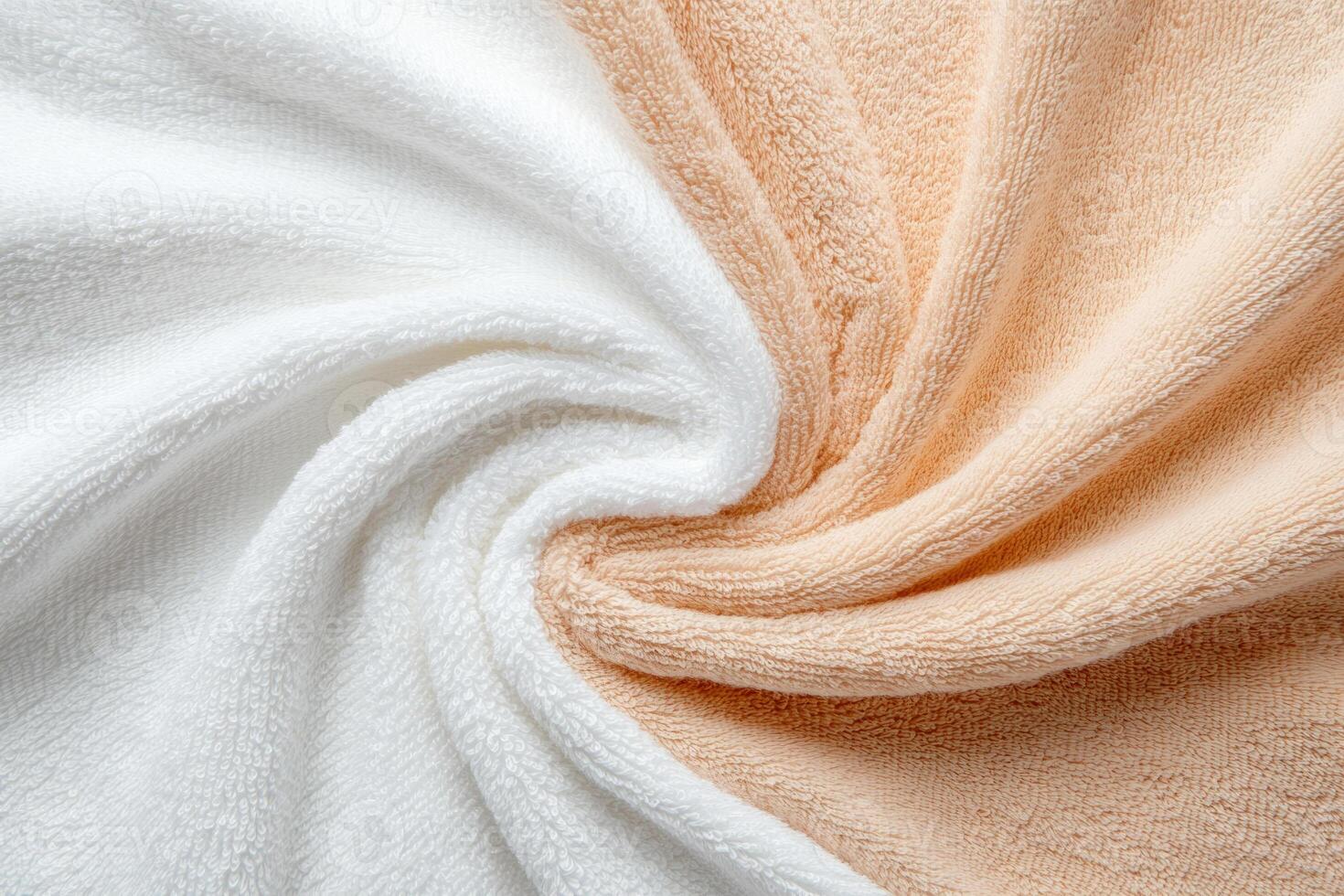 White and peach towels with a soft texture draped in folds photo