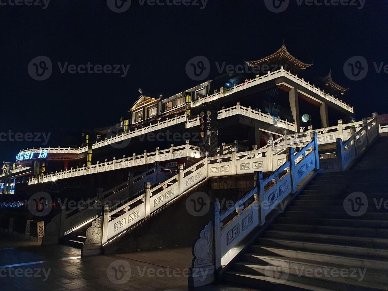 night view of a temple lighted up with neon lighting photo