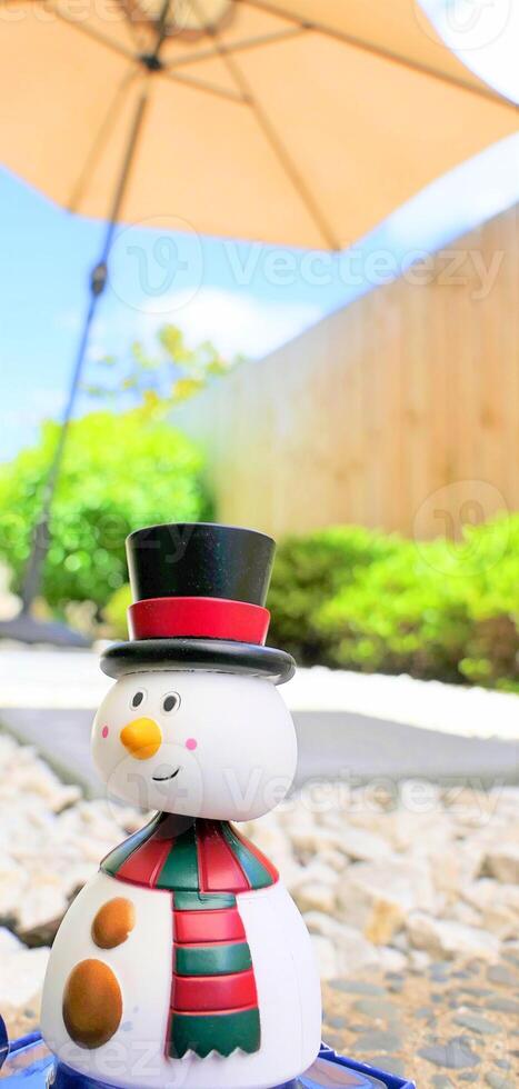 Shot of snow man having a summer Christmas holiday photo