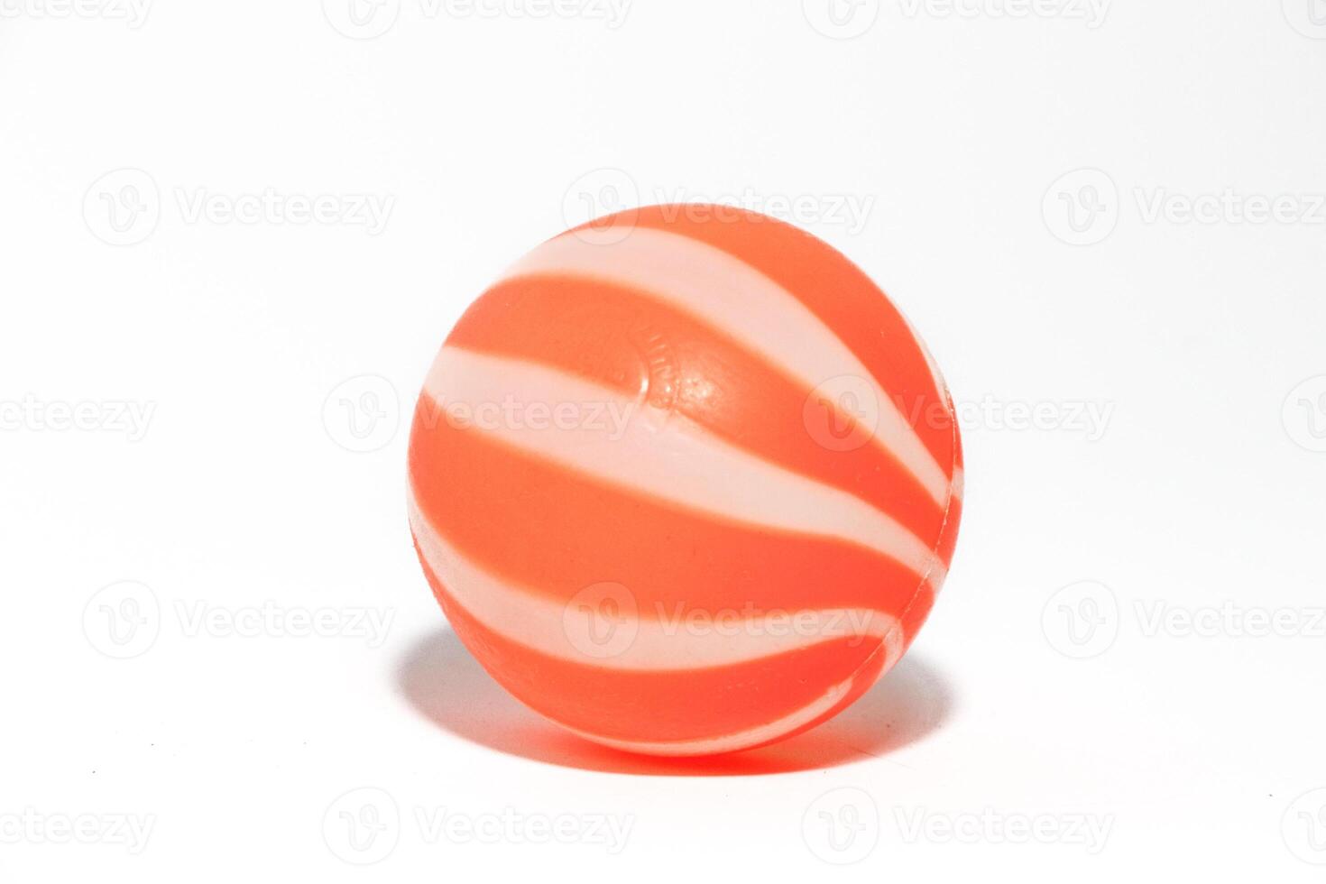 ittle orange ball isolated on a white background photo