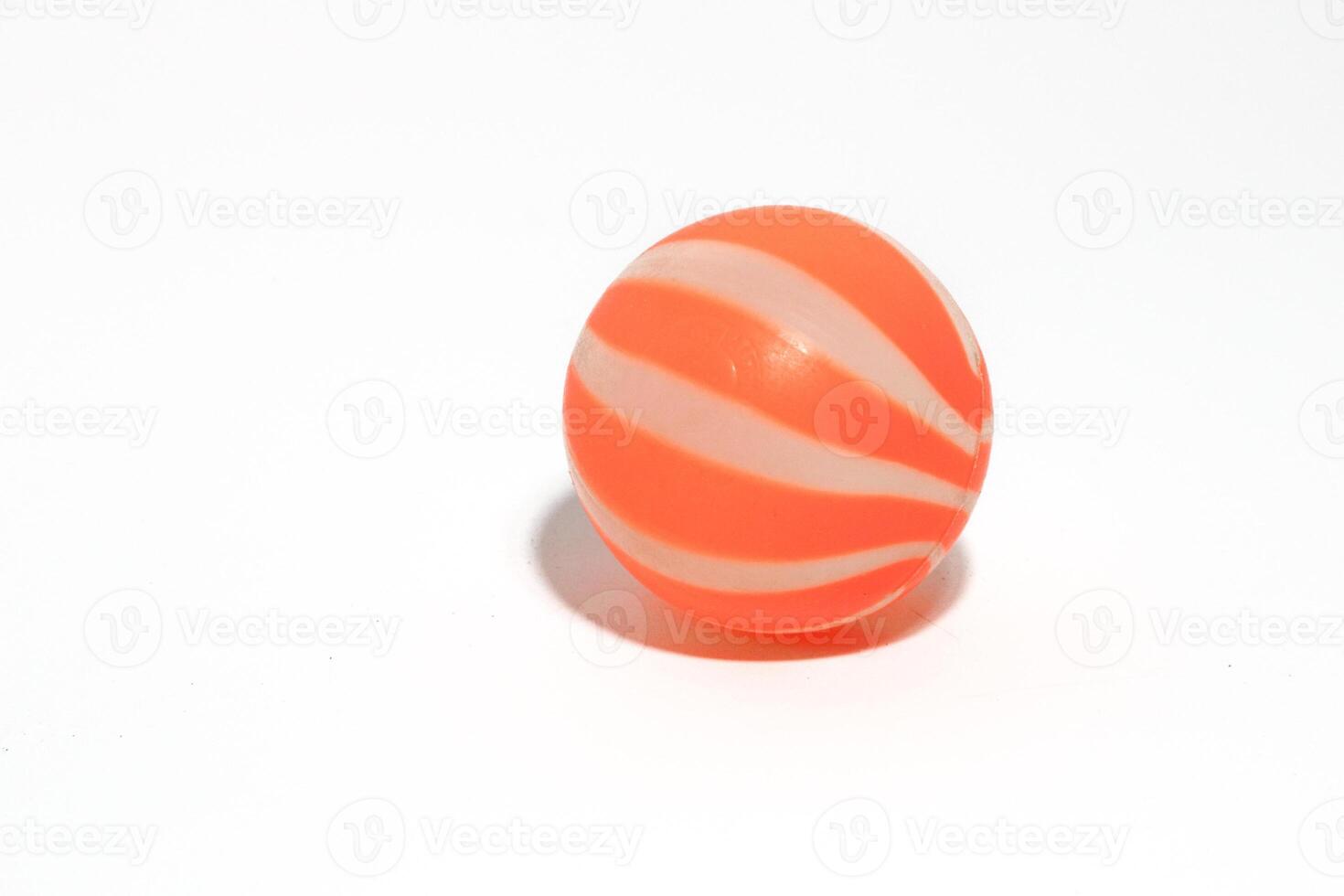 ittle orange ball isolated on a white background photo