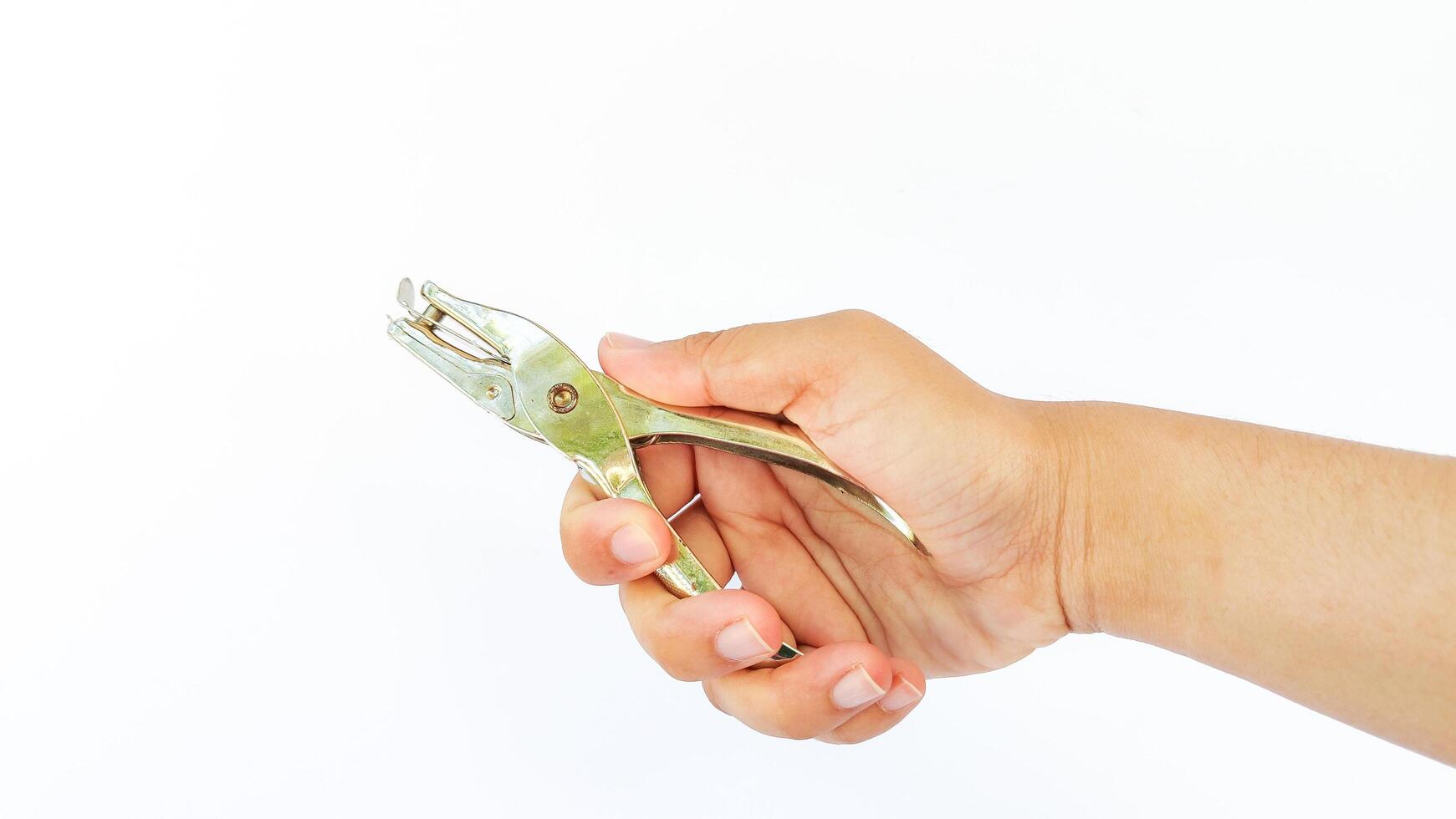 metal single paper hole puncher in white isolated background photo