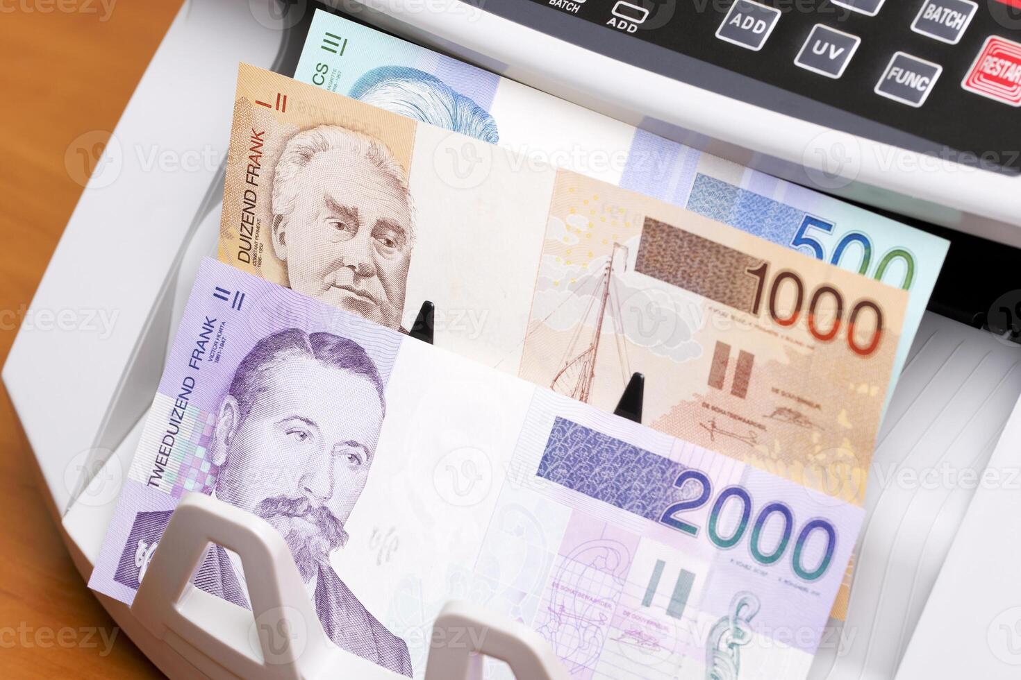 Belgian franc in the counting machine photo