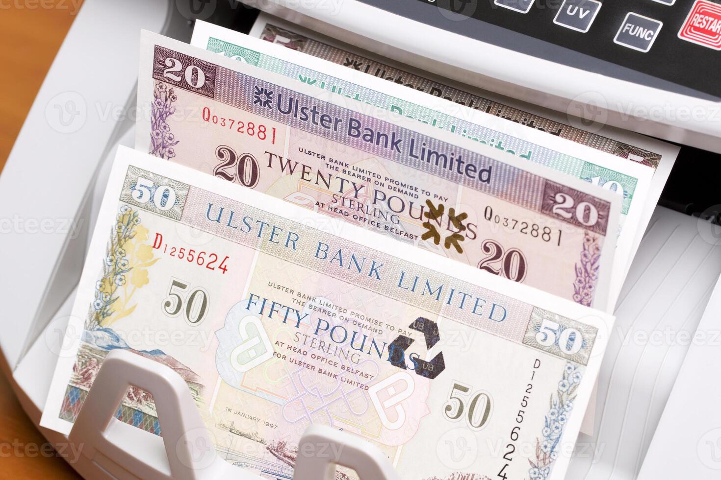 Irish pound in the counting machine photo
