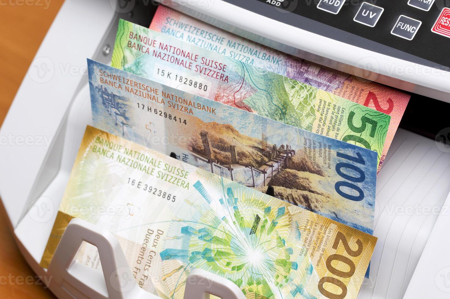 Swiss franc in the counting machine photo