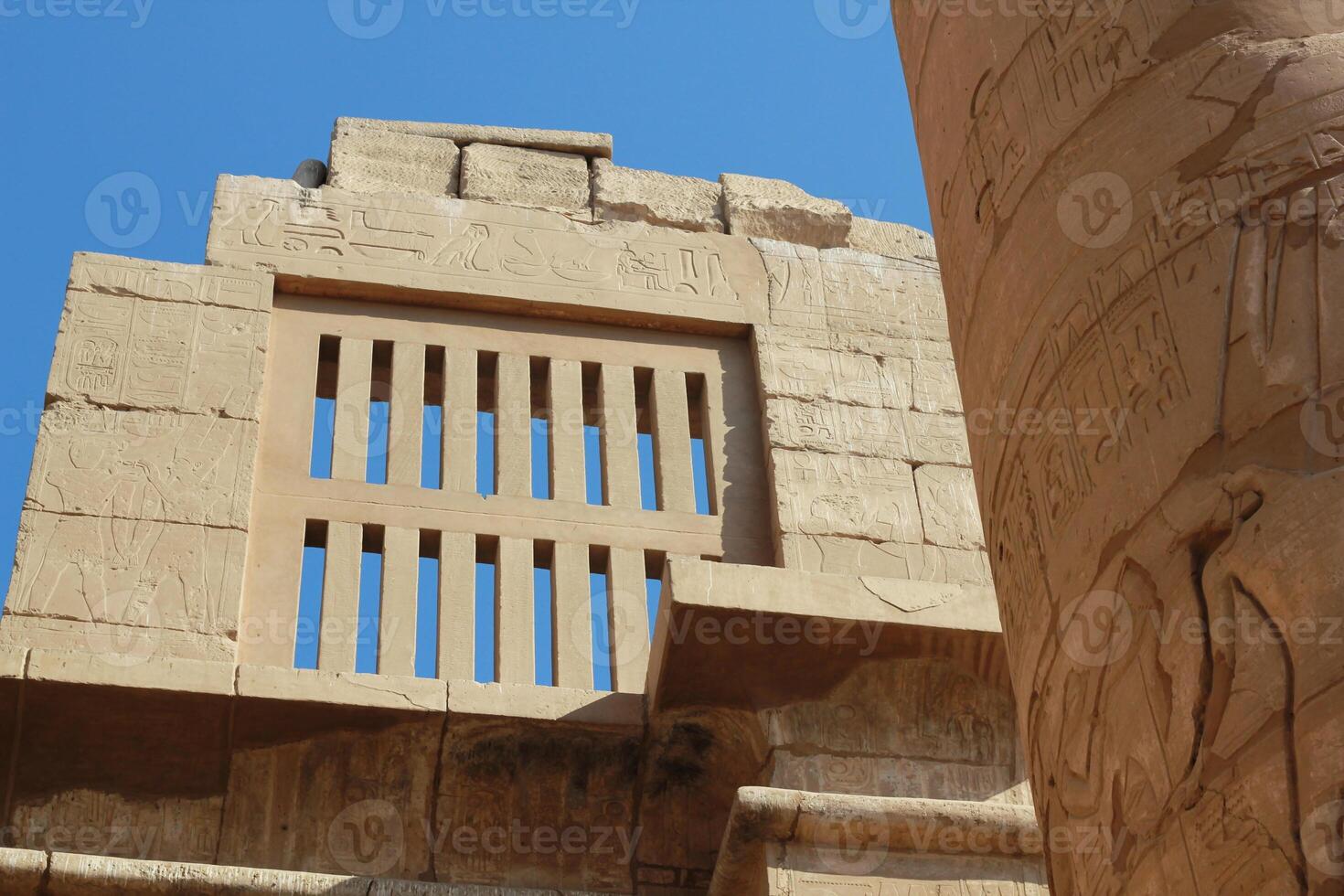 Part of the wall and column at the ancient egyptian temple, in Luxor, Egypt. photo