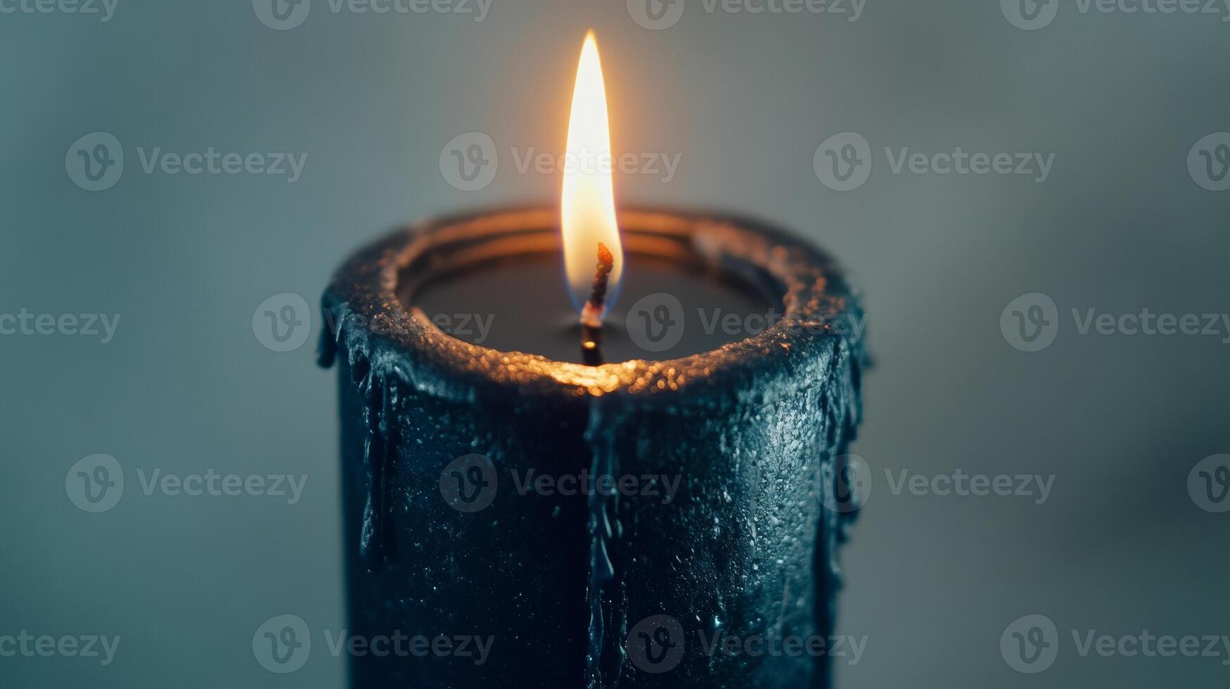 Black candle with flame in dim light, calming and serene atmosphere concept photo