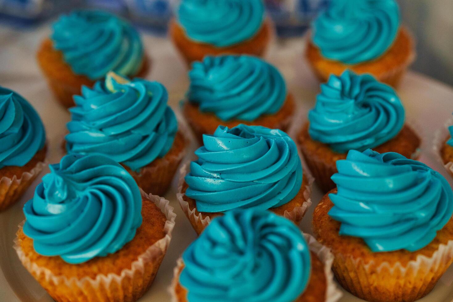 a white plate with blue frosting on it photo