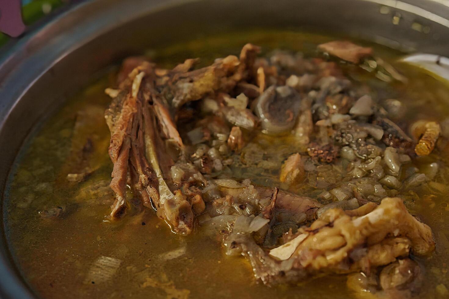a bowl of soup with a spoon in it photo