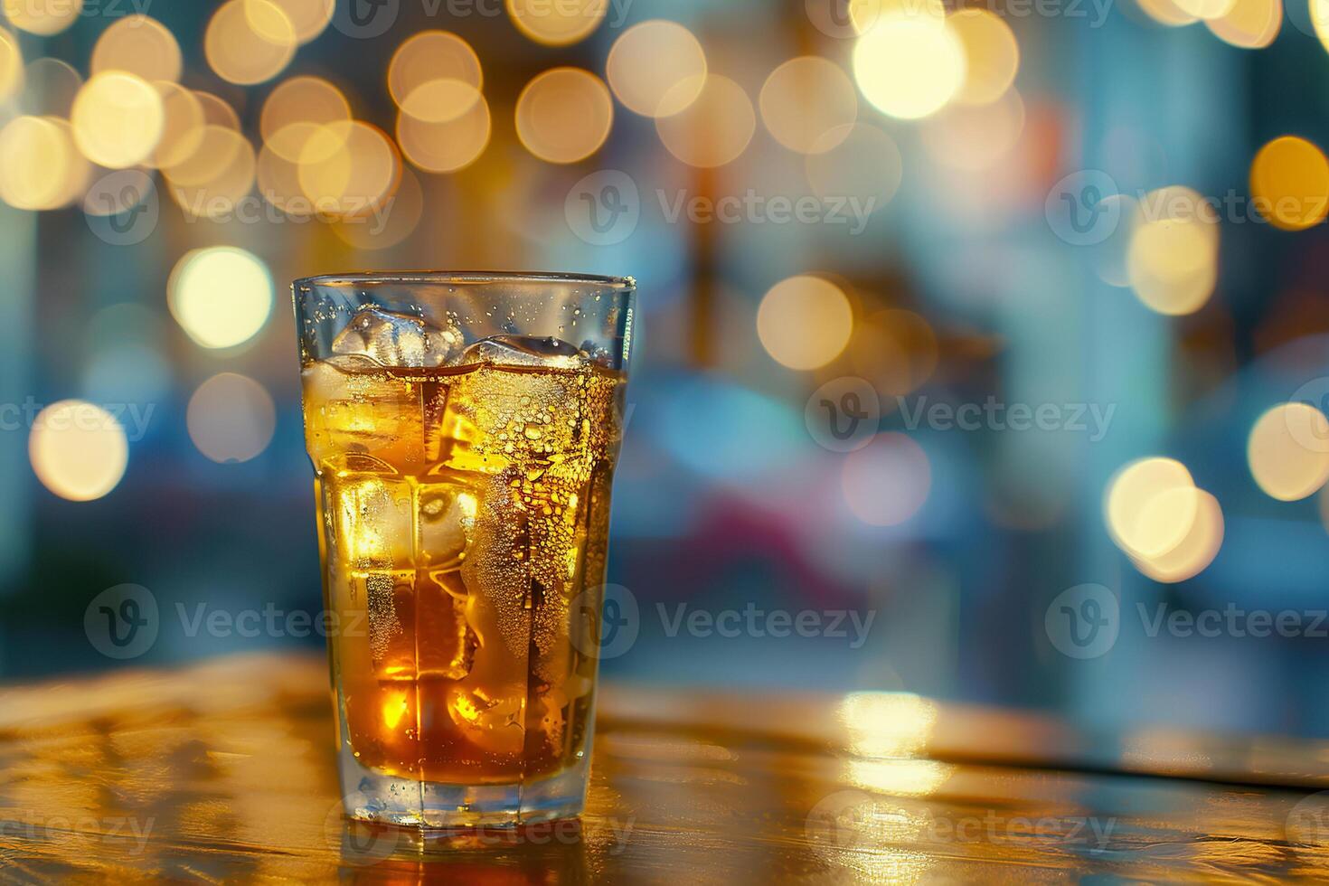 Refreshing iced tea served in a glass with a blurred and glowing background at a cafe. photo