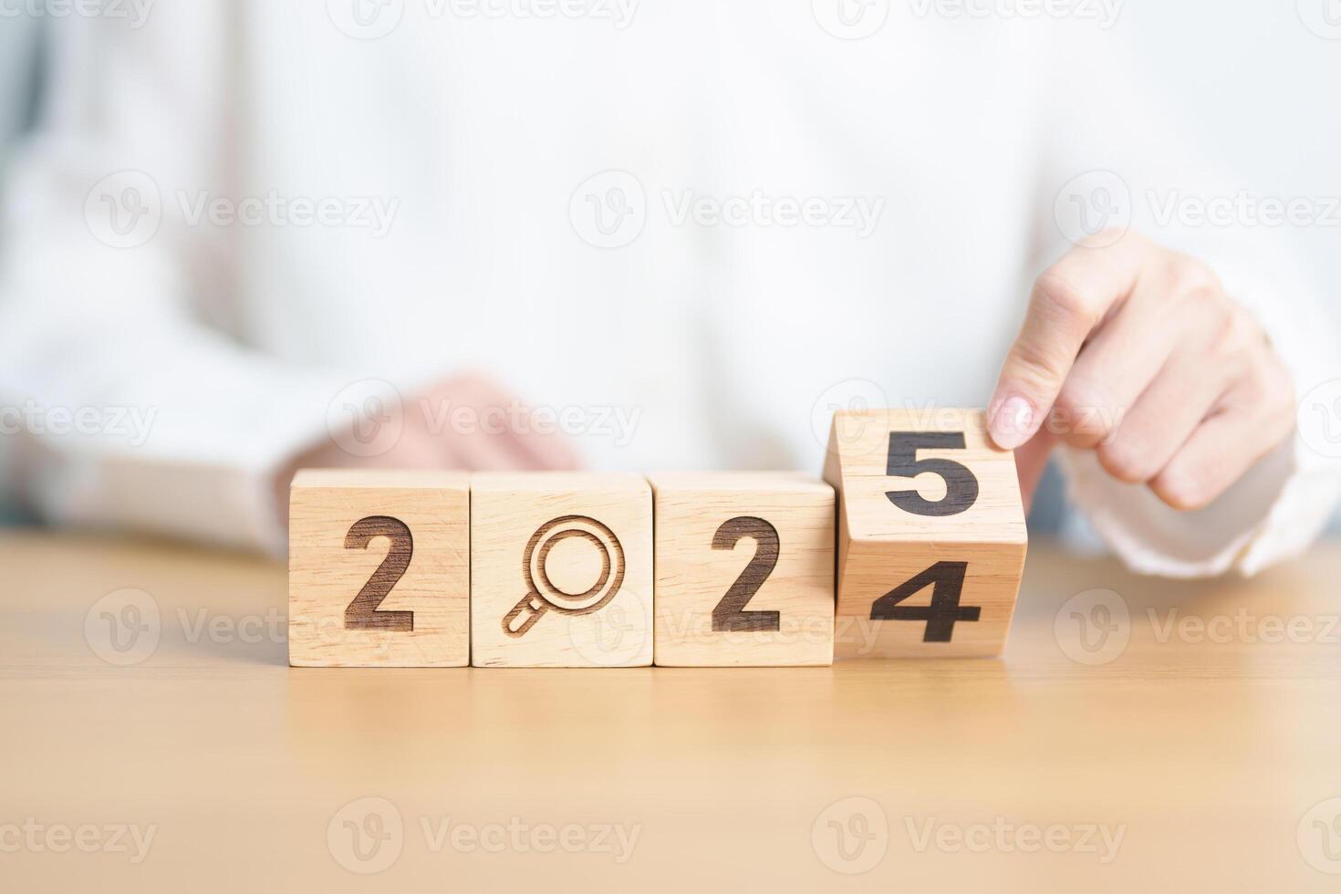 2024 year change to 2025 year block with magnifying glass icon. SEO, Search Engine Optimization, hiring , Advertising, Idea, Strategy, marketing, Keyword, Content and New Year start concepts photo