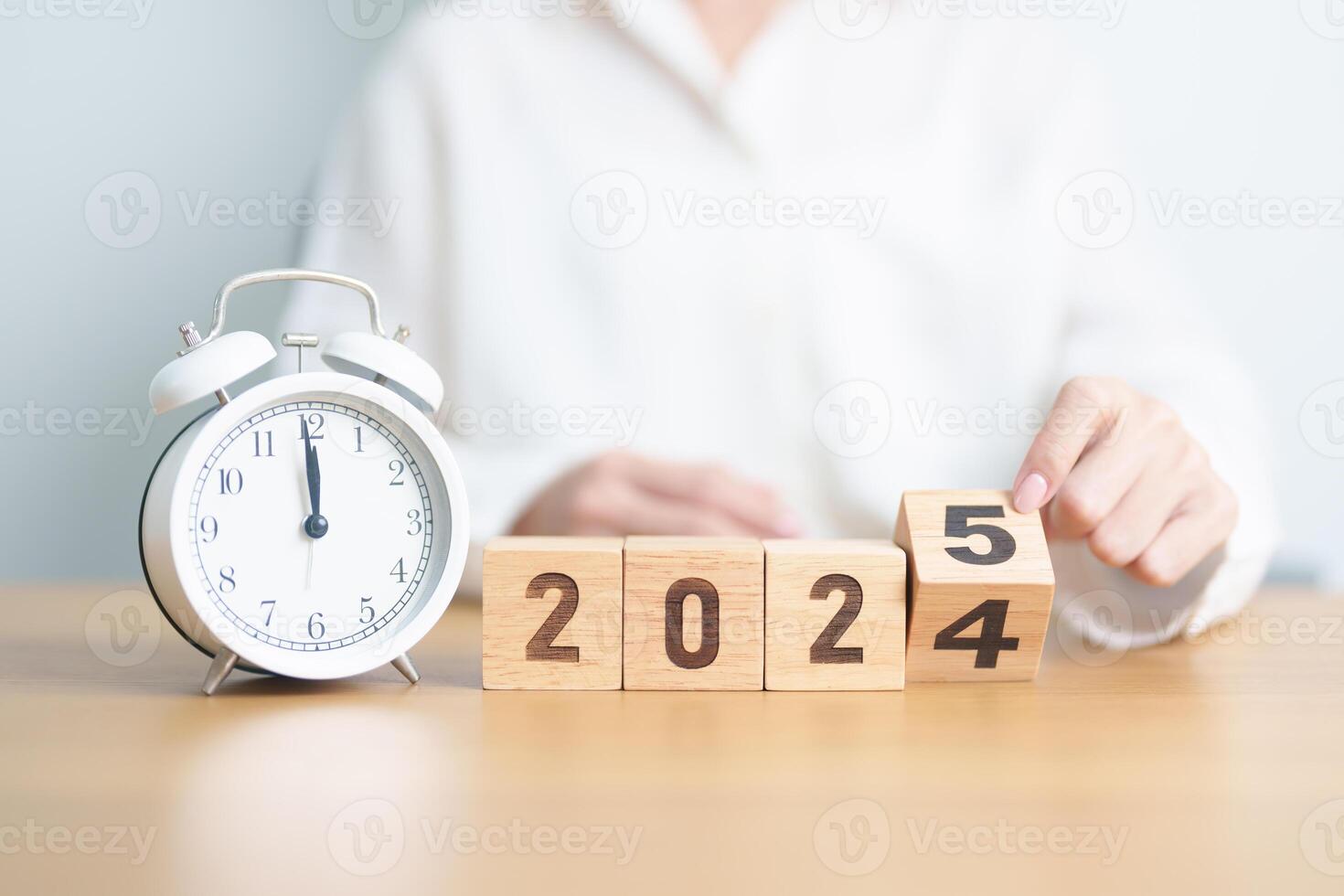 2024 end year to Happy New Year 2025 with vintage alarm clock. Christmas, New Start, Resolution, countdown, Goals, Plan, Action and Motivation Concept photo