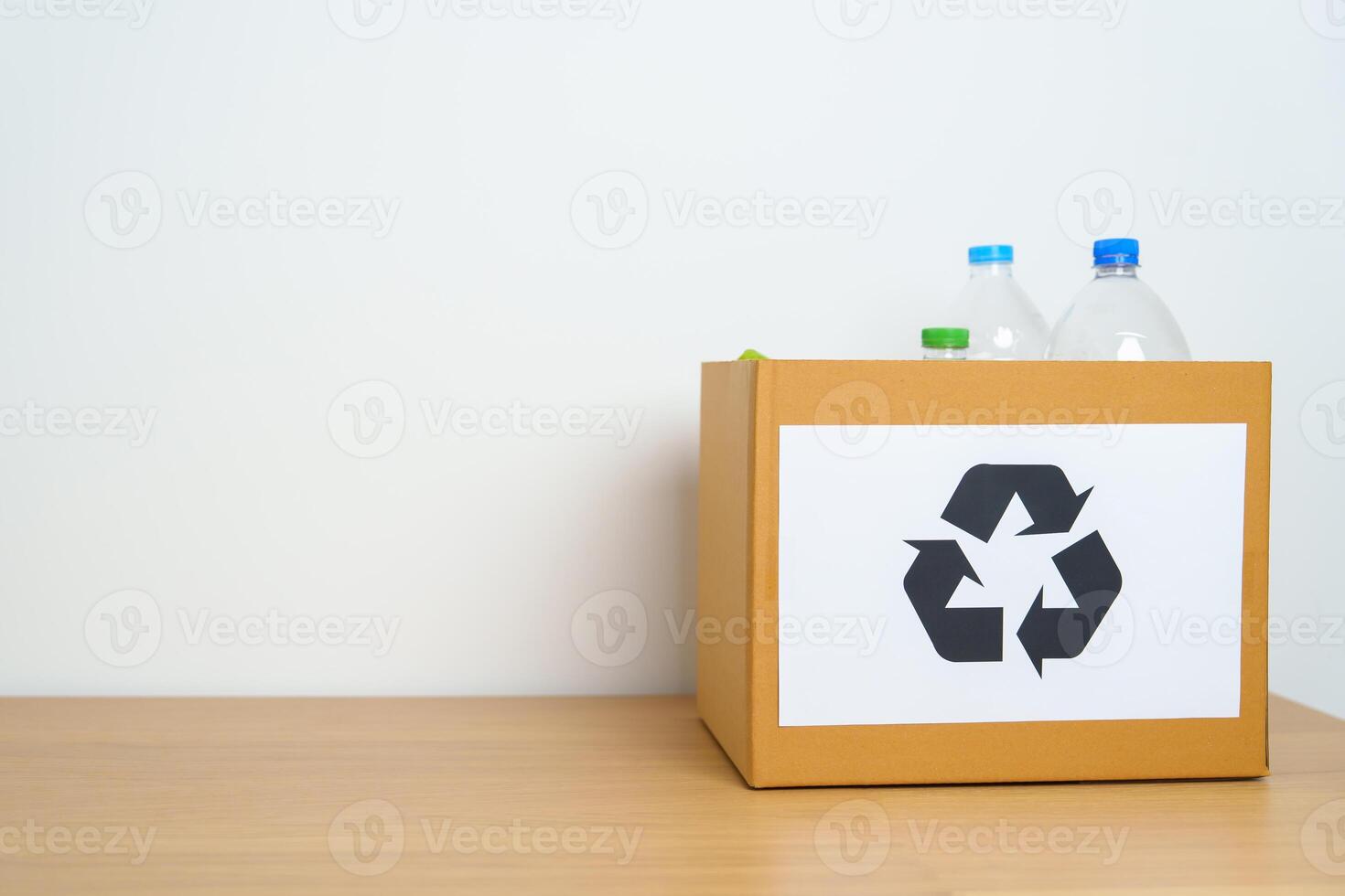 Plastic bottle in paper box at home or office. Recycle garbage Sorting. Plastic Free, Ecology, Environmental, pollution, Dispose recycling, waste management and trash Separation concept photo